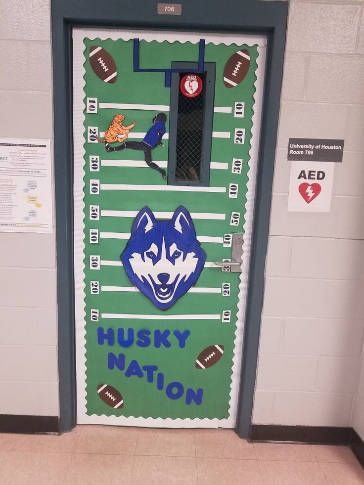 the husky nation door is decorated with footballs and other sports related items on it