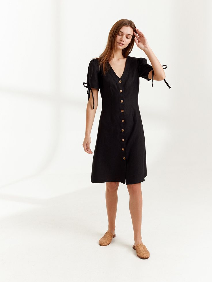 "MONICA is a knee length linen button down dress. DETAILS - Center front buttons - V neck - Knee length - Fitted bodice - No pockets - Oeko-Tex certified 100% lightweight linen - Cut and sewn to order just for you in our studio COLOR - Black, you can also choose other colors above - Fabric samples are available here https://www.etsy.com/listing/586569696/linen-fabric-samples SIZING & FIT - Fits true to size - Length (shoulder to hem) is approximately 39 inches / 99 cm - Bust approximately 33 Chic Short Sleeve Linen Dress With Buttons, Chic Linen Day Dress With Buttons, Chic Daywear Linen Dress With Buttons, Chic Linen Dress With Buttons For Daywear, Knee-length Cotton Midi Dress With Buttons, Day Out Button-up Linen Dress, Chic Linen Button-up Dress, Chic Linen Dress With Buttons For Workwear, Linen Dresses With Buttons For A Day Out