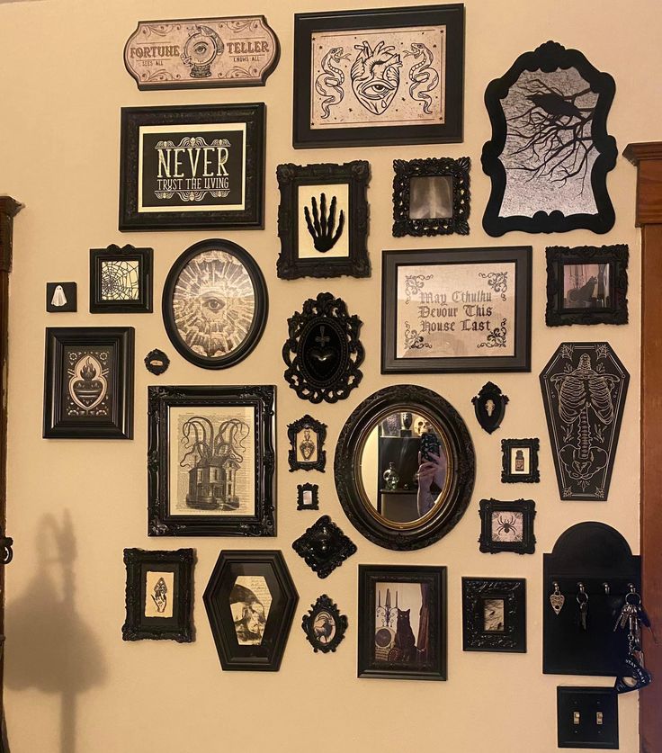 there are many framed pictures on the wall