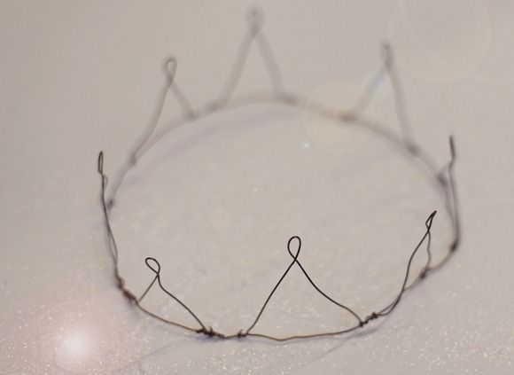 a close up of a wire crown on a table