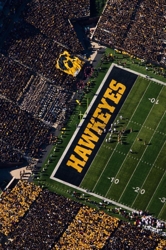 an aerial view of a football field with fans