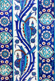 blue and white tiles with floral designs on them