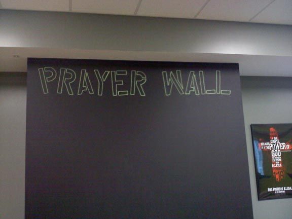 a blackboard with writing on it that says prayer wall