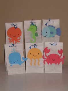 four little bags with different designs on them