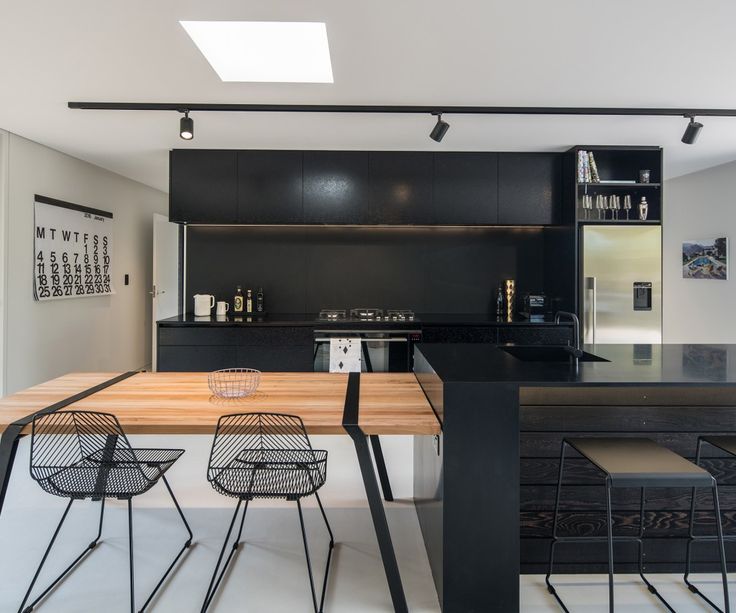 the kitchen is clean and ready to be used as a dining room or office space