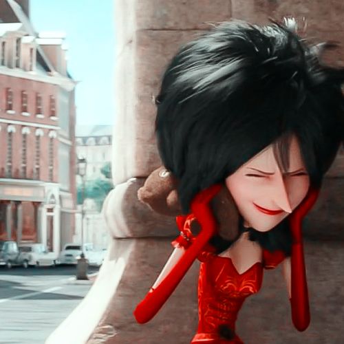 the animated character is dressed in red and has her hair pulled back with long black hair