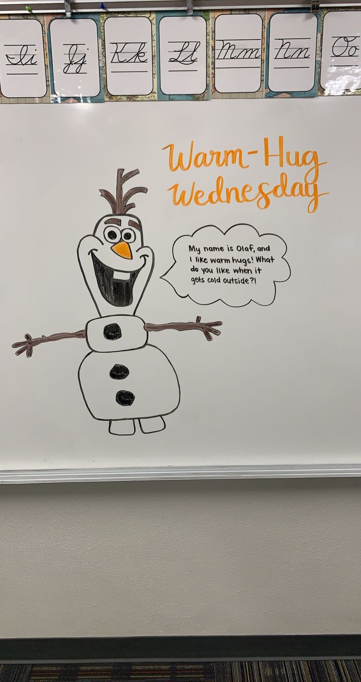 a sign that says warm - hug wednesday on the wall