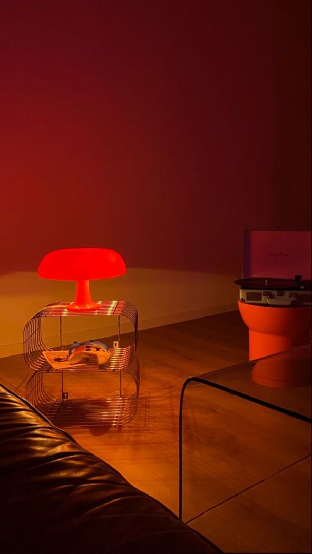 a living room filled with furniture and a red light