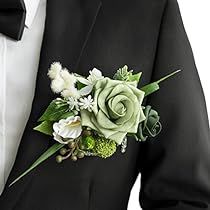 a man in a tuxedo wearing a boutonniere with flowers on it