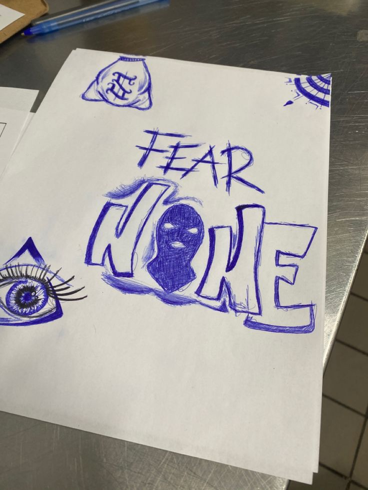 a piece of paper with blue ink on it that says fear more next to an eye