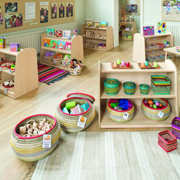 a child's playroom with baskets and toys