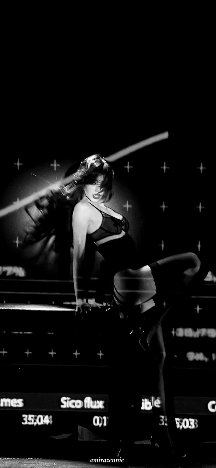 a black and white photo of a woman holding a baseball bat