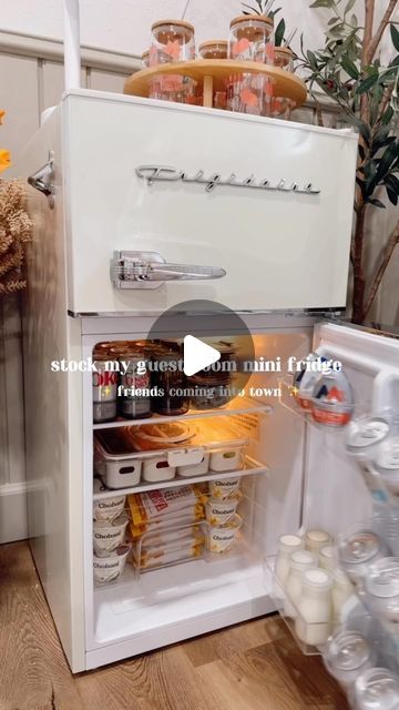 an old fashioned refrigerator with its door open and food in the freezer compartment inside