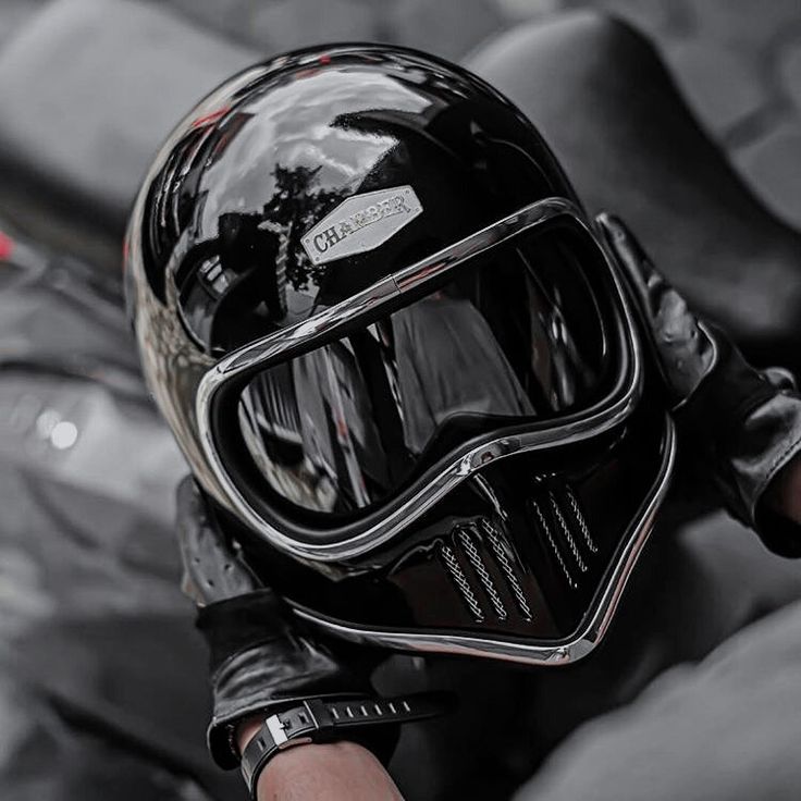 a person wearing a motorcycle helmet and goggles