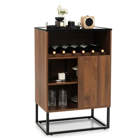 a wooden cabinet with two shelves filled with wine bottles and glasses on top of it