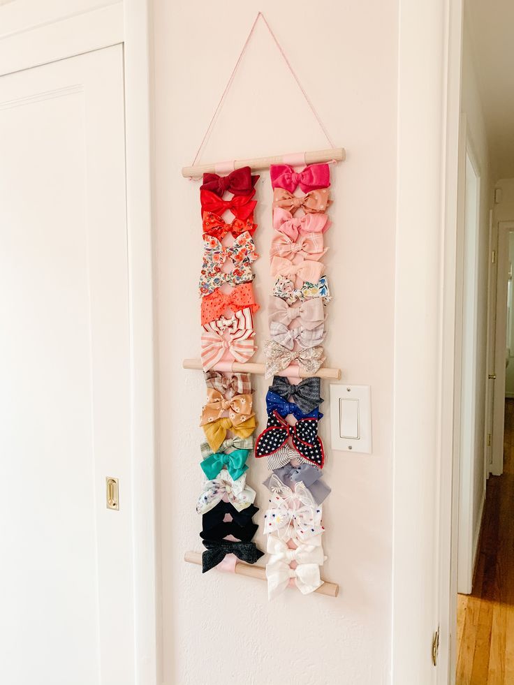 the wall is filled with different types of bow ties