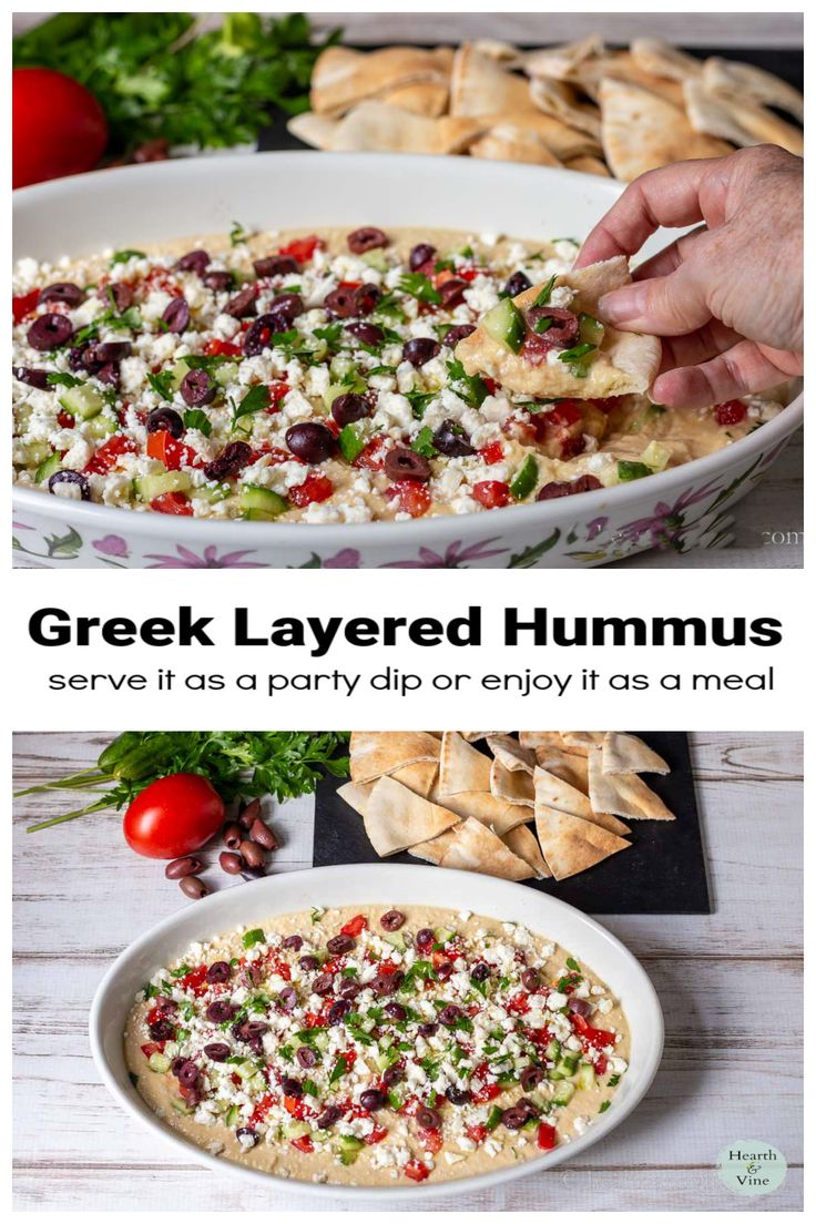 greek layered hummus served in a bowl with pita chips and garnishes