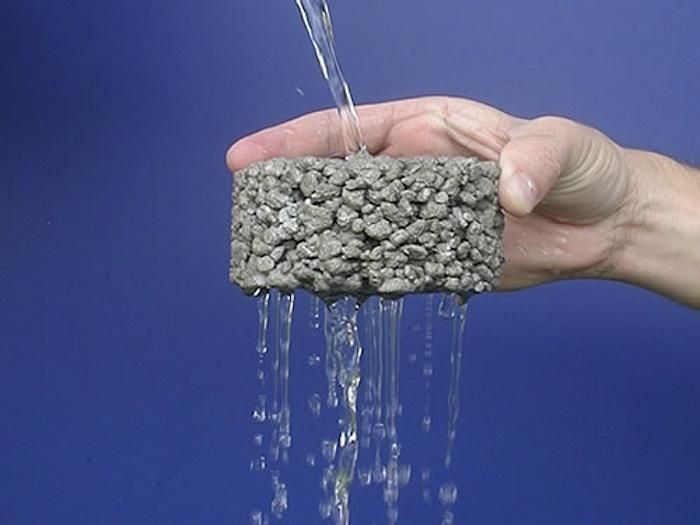 a person is pouring water from a faucet into their hand, with blue background