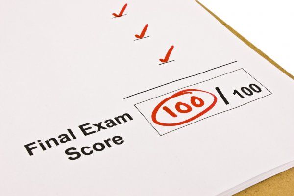 a final exam score sheet with red marker on it stock photo - image 399781