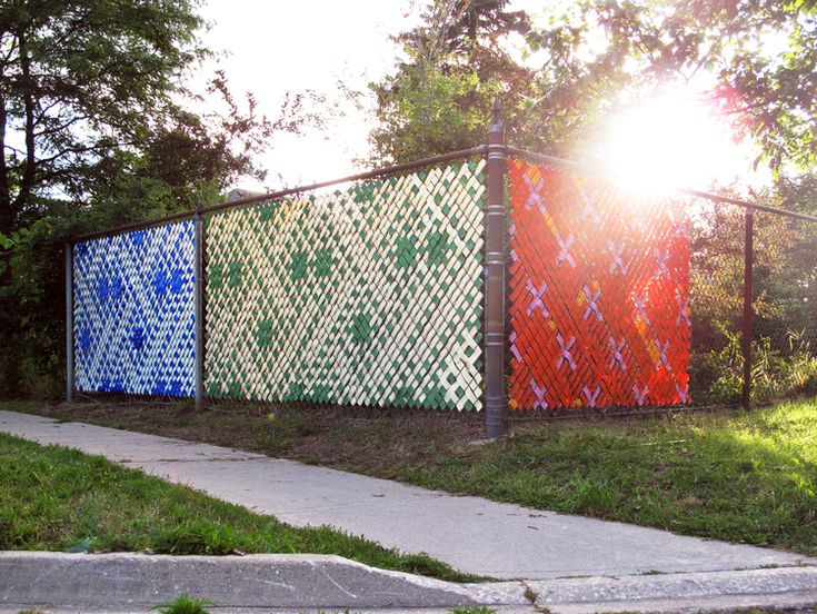 the fence is decorated with different colored squares