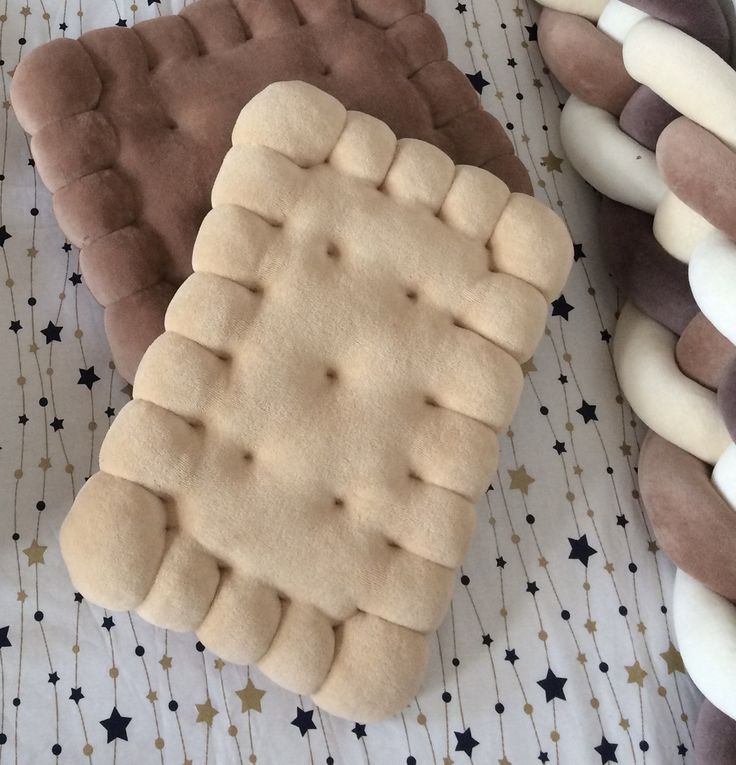 some cookies are laying next to each other on a table with stars and lines around them