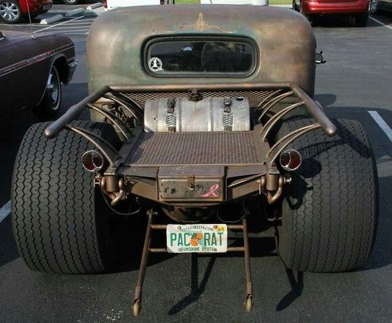 an old pick up truck is parked in a parking lot