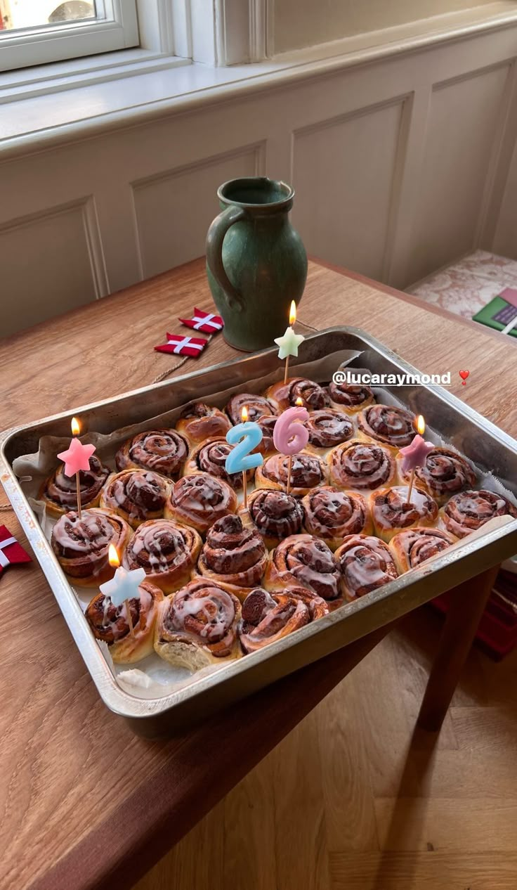 a pan filled with cupcakes on top of a wooden table