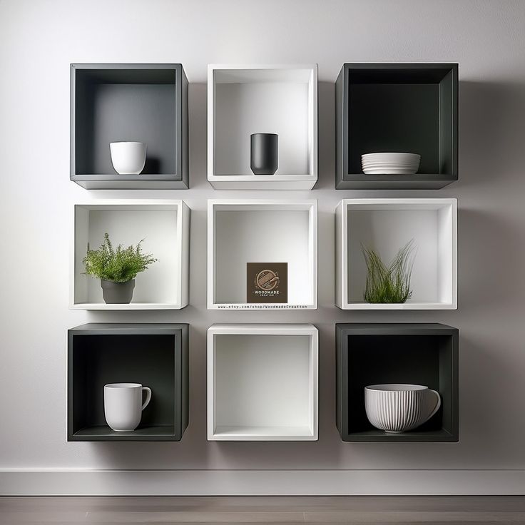 the wall is made up of cubes with plants and bowls on them in different shapes