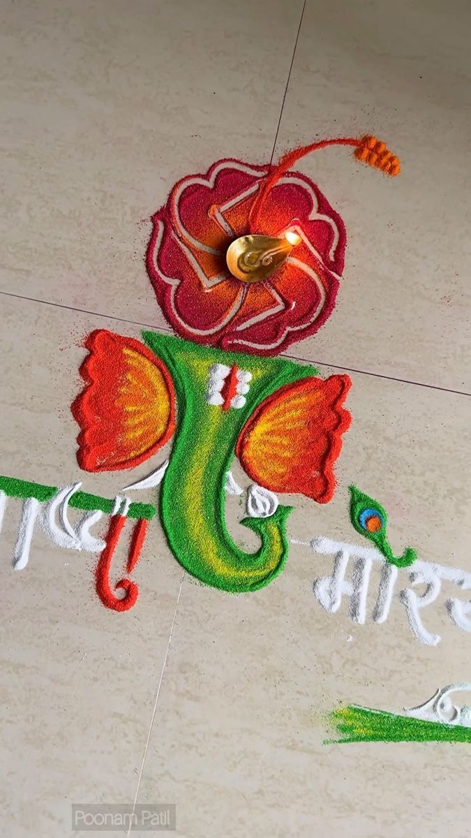 the words rangti written in white and red on a tile floor with a flower