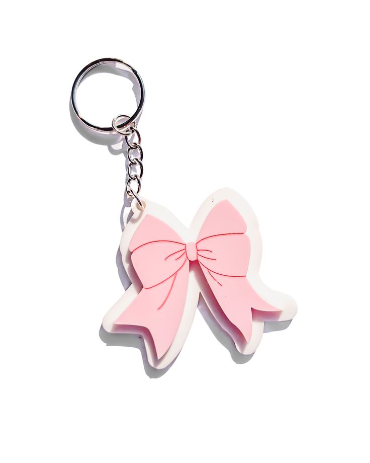 a keychain with a pink bow on it's front and back ends