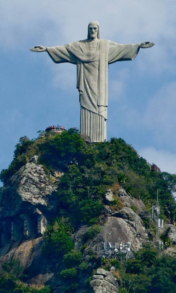 the statue of christ is on top of a hill