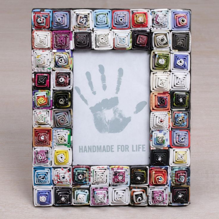 a multicolored photo frame with a hand print on it