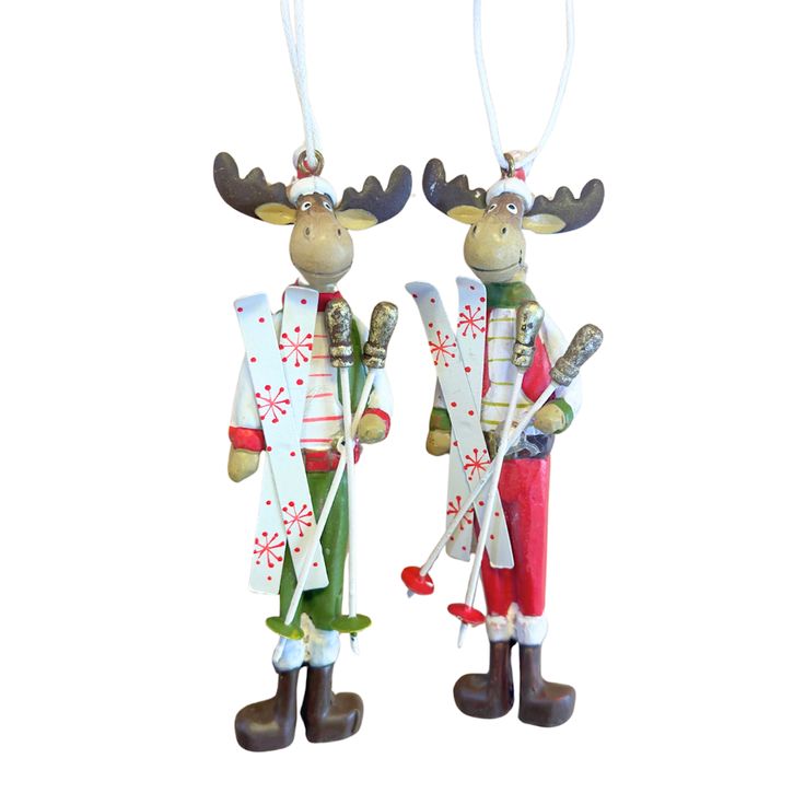 two christmas ornaments hanging from strings on a white background, one is wearing an antlers outfit and the other has a red hat