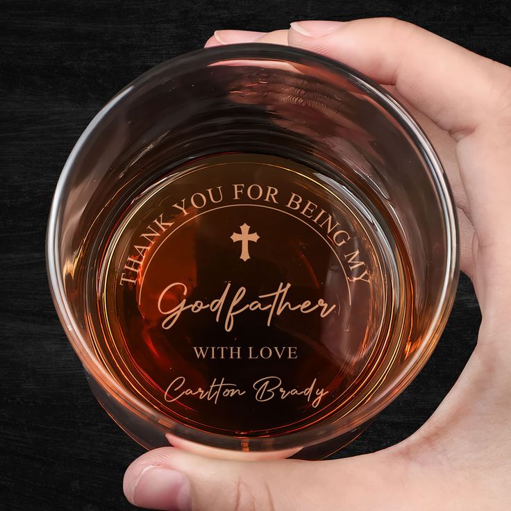 a person holding a glass bowl with the words thank you for being my god father