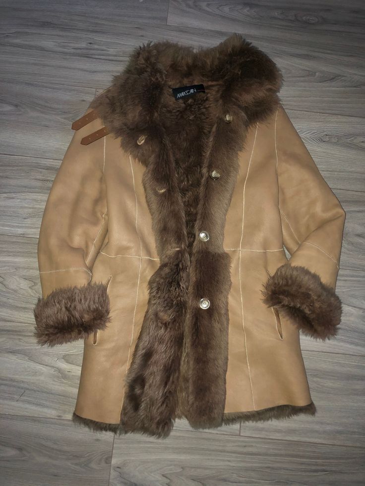 Very beautiful Tan leather shearling coat can be worn both sides, as a fur coat or leather coat with fur lining. High quality shearling, lightweight coat. Marc Cain Size N2, best fit sizes S/M chest 50cmx2, length 80cm, sleeve when unrolled 62cm Very good condition! Brown Sheepskin Outerwear With Faux Fur Trim, Brown Sheepskin Outerwear With Faux Fur Lining, Brown Shearling Fur Coat With Faux Fur Trim, Brown Shearling Fur Coat, Brown Shearling Fur Coat With Long Sleeves, Brown Fur Coat With Faux Fur Lining, Winter Leather Fur Coat In Mink Color, Brown Sheepskin Coat With Faux Fur Trim, Brown Sheepskin Fur Coat With Faux Fur Trim