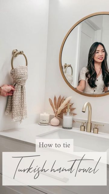 a woman standing in front of a bathroom mirror with the words how to tie turkish knot towel