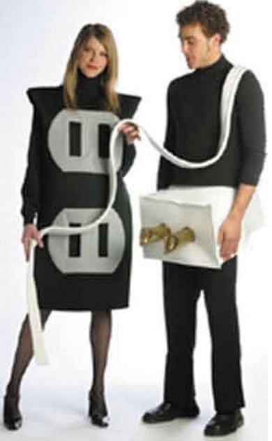 a man and woman dressed up in halloween costumes, standing next to each other with an electrical outlet attached to their butts