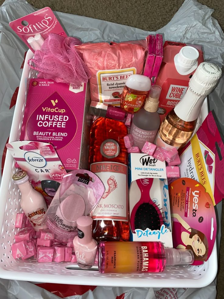 a white basket filled with lots of pink items