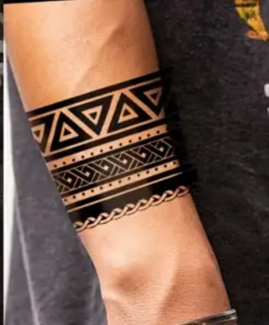 a man with a tattoo on his arm