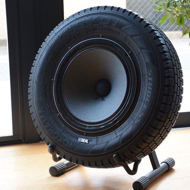 a large tire sitting on top of a wooden floor