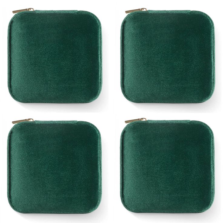 four pieces of green velvet covered jewelry cases