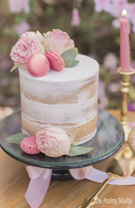 a white cake with pink flowers on top