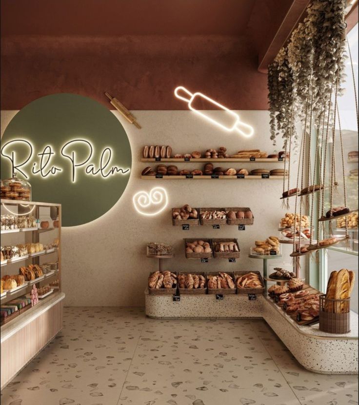 the interior of a bakery with baked goods on display