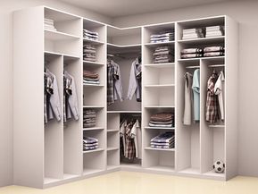 an open closet with clothes and shirts on shelves in the corner, next to a soccer ball