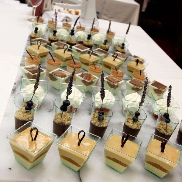 there are many desserts on the table ready for guests to enjoy them at this event