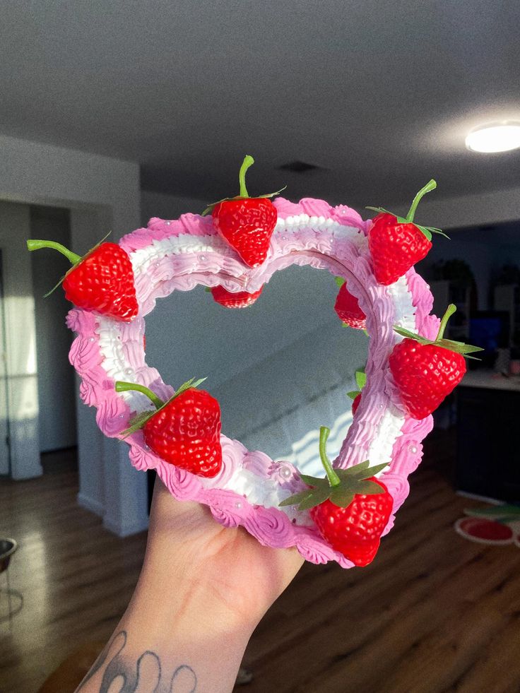 Faux Vintage Heart Cake Mirror! This is a 7" hand pipped cake mirror. It can be hung up on a wall or stood up on a shelf/vanity like a picture frame. This is a CUSTOM ORDER. You will have to pick your color wave, fruit options, and more! The mirror is hand piped using acrylic paint and lightweight spackle. The material hardens after 24-48 hours!  *NOT MEANT FOR TRAVEL* This mirror is made with a material that last best/longest when left alone for DECOR. At check out Please fill this out Color: Fruit: Rhinestone/Pears: Additional information/Request: Color: i.e (Monochromatic Pink) (Light pink, White, Dark Pink) Fruit/Toppings: i.e Cherries, Strawberries, Half/Half, Disco Balls, Bows Rhinestone/Pearls: i.e (Yes, white rhinestones) (None.) If you do not see any custom options please reach ou Fake Cake Wall Decor, Fake Cake Mirror, Bazar Ideas, Cake Mirror, Maximalist Wall Decor, Faux Cake, Fake Cakes, Mini Business, Clay Diy Projects