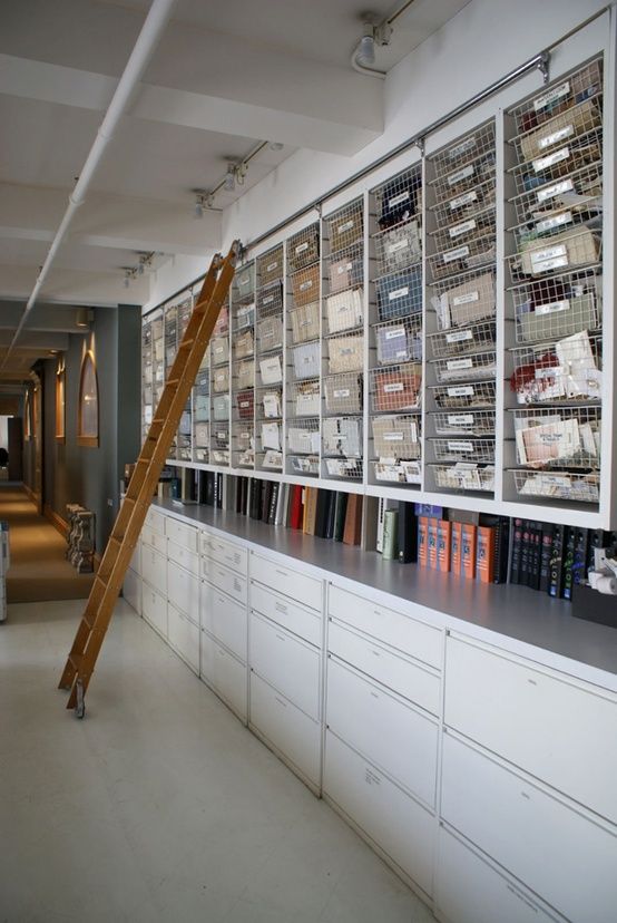 a ladder leaning up against a wall filled with books