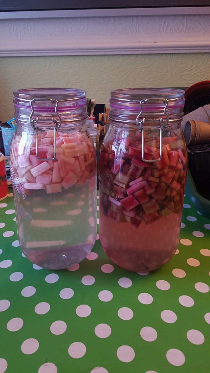 three jars filled with food sitting on top of a green and white polka dot table cloth