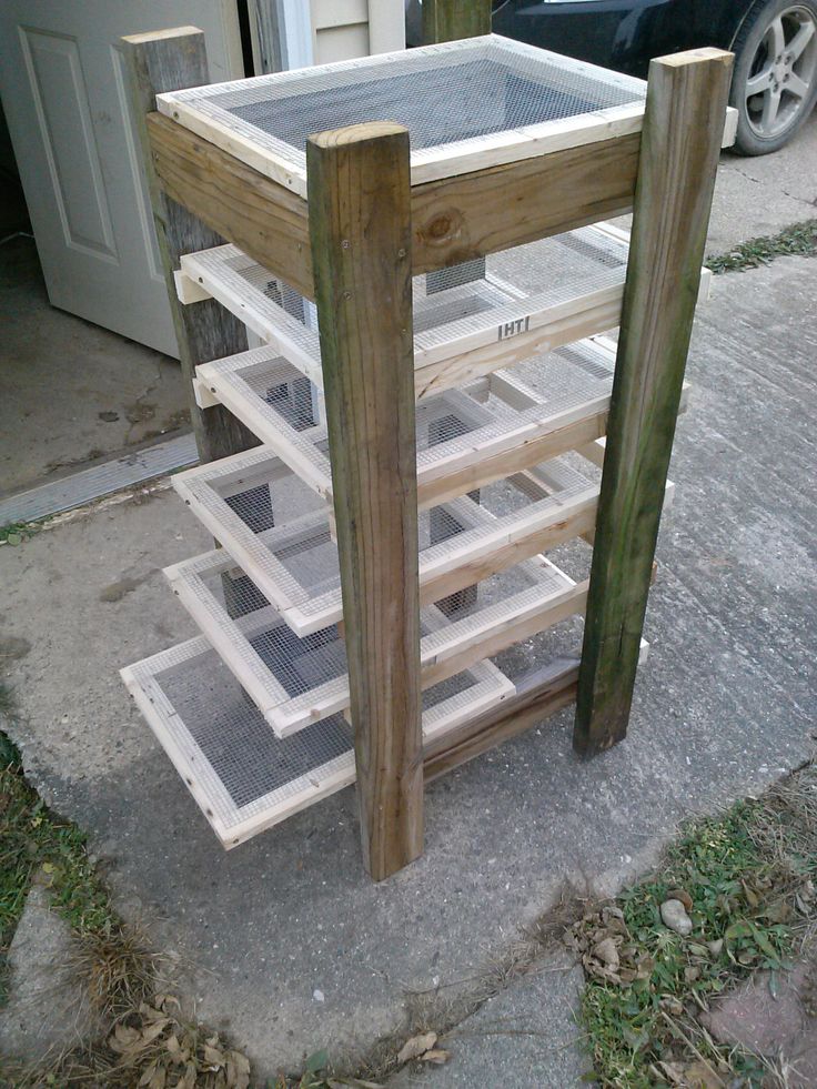 a stack of wooden shelves sitting on top of a sidewalk