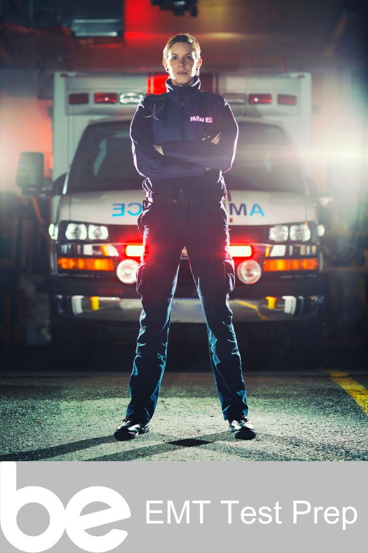 a man standing in front of an ambulance with his hands on his hips and the words emt test prep written below him